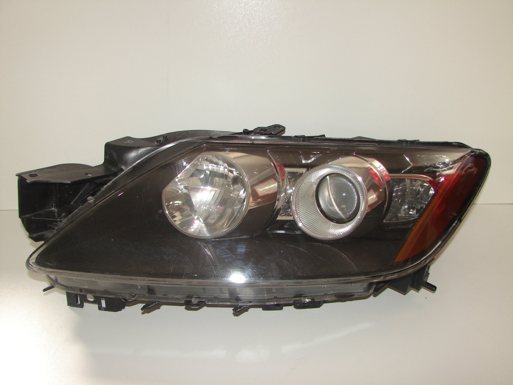 Reflektor lampa przednia lewa MAZDA CX7 ER 0612