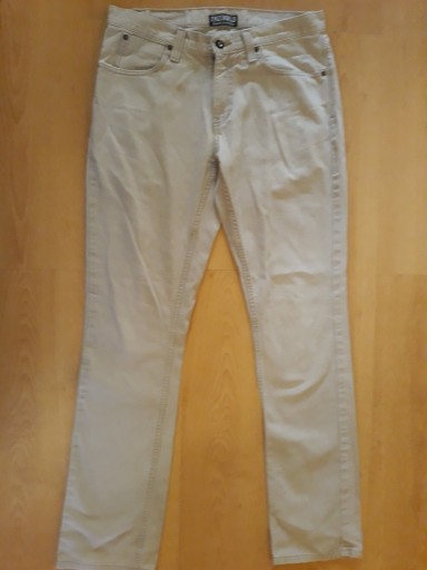 Zdjęcie oferty: FREEWORLD Spodnie Jeans rozm 33, beż z USA